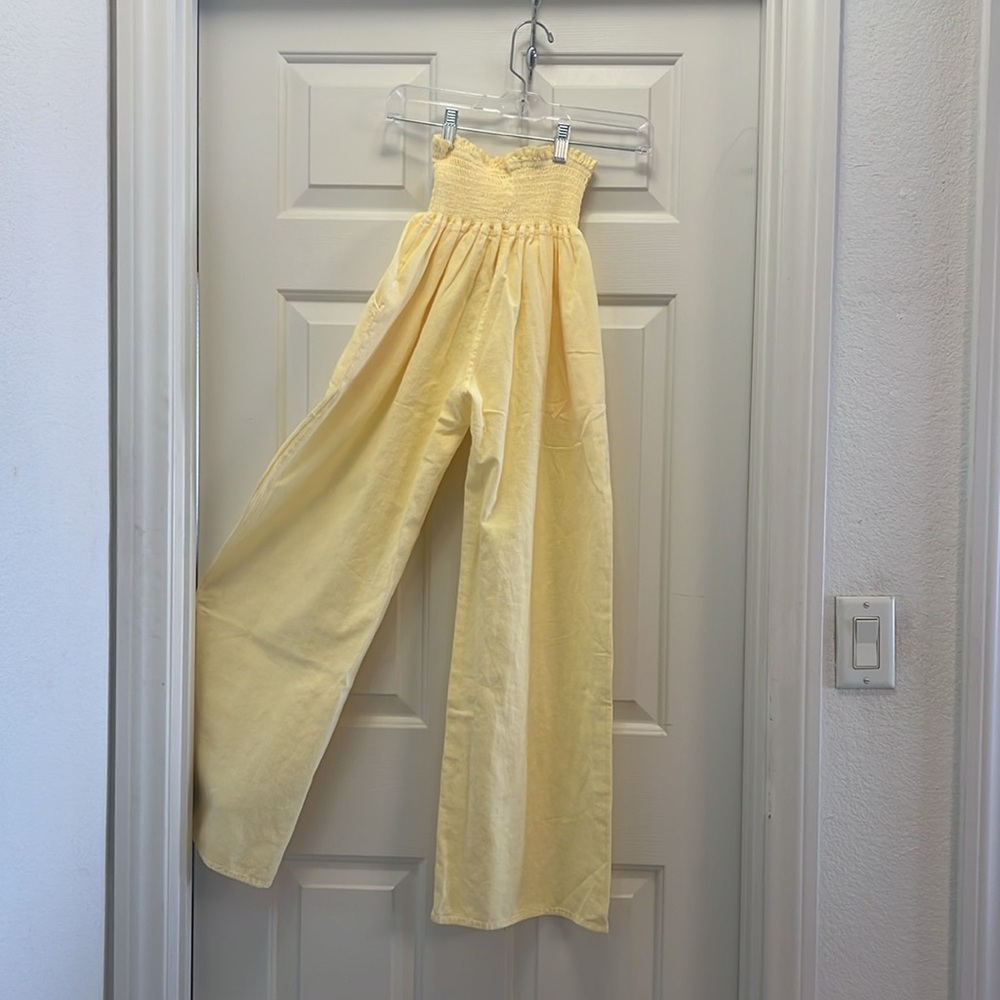Adorable NWT light yellow baggy pants. Stretch material waist.